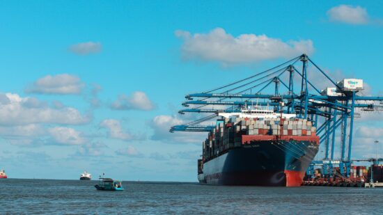 Container carrier waiting to take off. Hai Phong International Container Terminal (HICT), Vietnam (Jully 2022)