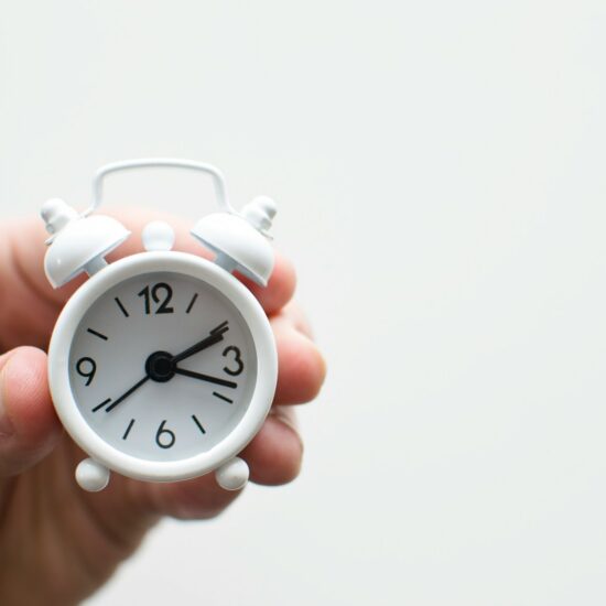 Alarm clock friends situation with hand
